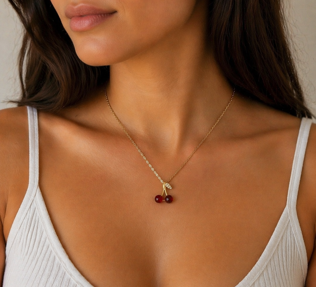 Woman wearing a delicate necklace with a small pendant