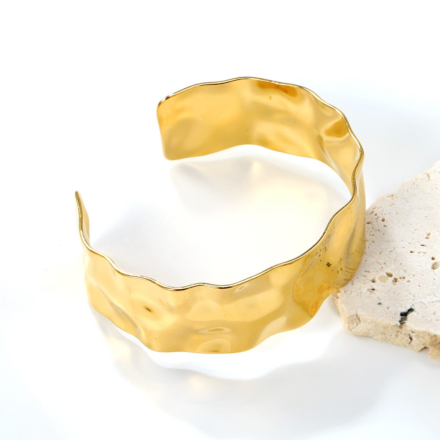 Gold bracelet on a white background