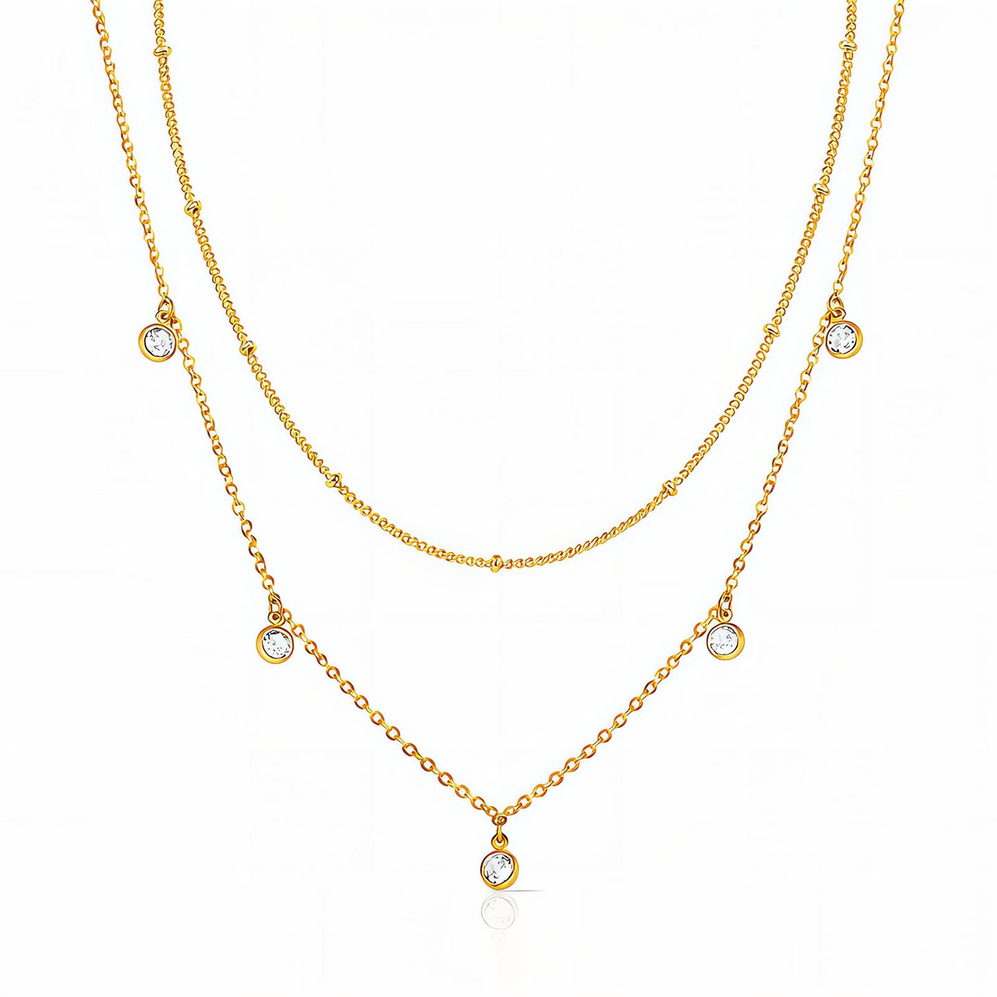 Two gold necklaces with small gemstones on a white background