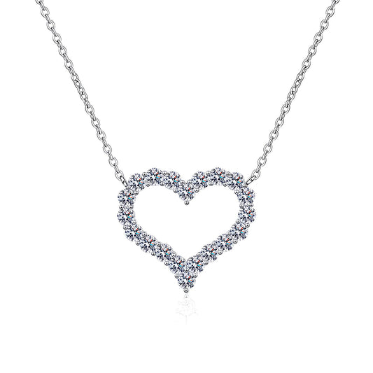 Heart-shaped diamond necklace on a white background