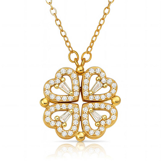 Gold necklace with a four-leaf clover pendant on a white background