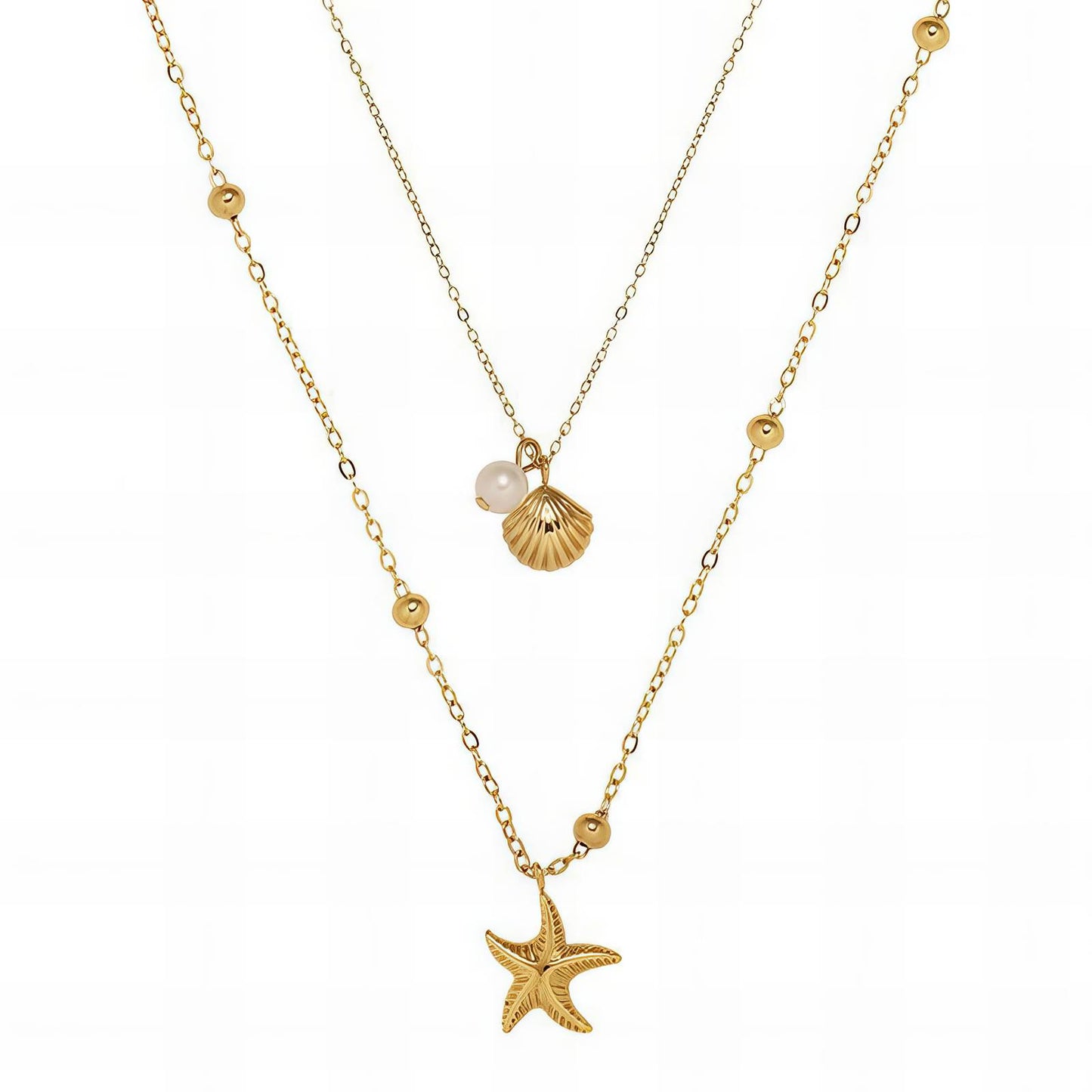 Gold necklace with starfish and shell pendant on a white background