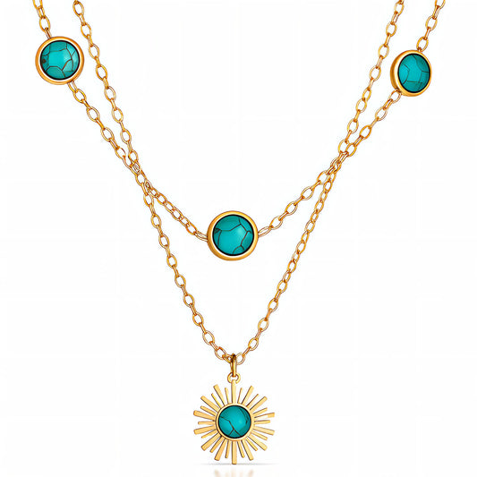 Gold necklace with turquoise stones on a white background