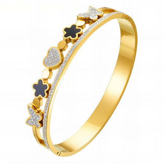 Gold bracelet with decorative elements on a white background
