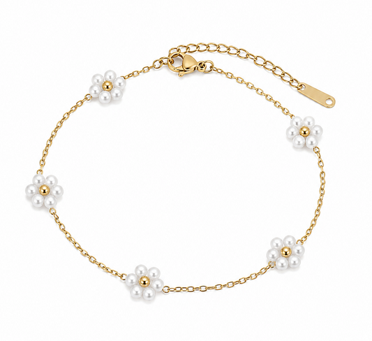 A delicate gold chain bracelet featuring five small white pearl flower motifs spaced evenly along the band, displayed on a clean white background.