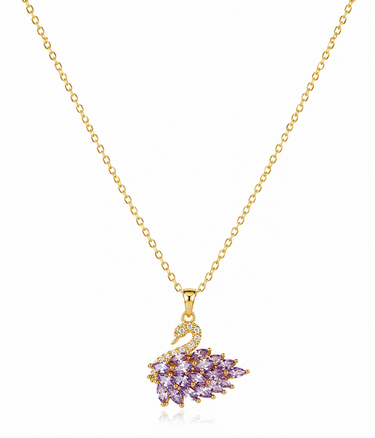 A gold chain necklace with a swan-shaped pendant featuring lavender purple marquise-cut stones and small clear accent stones, shown on a white background.