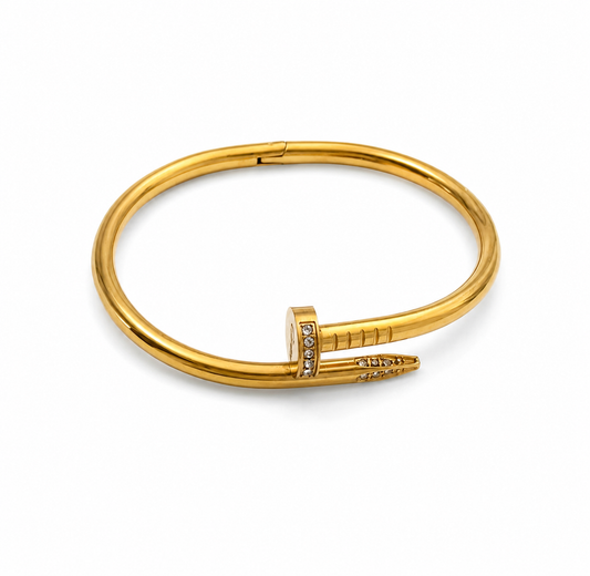 Gold bracelet with a unique design on a white background