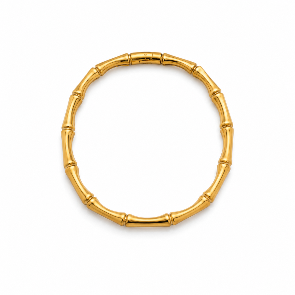 Gold bracelet with bamboo design on a white background