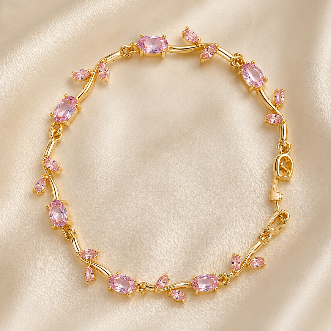 Gold bracelet with pink gemstones on a beige fabric background