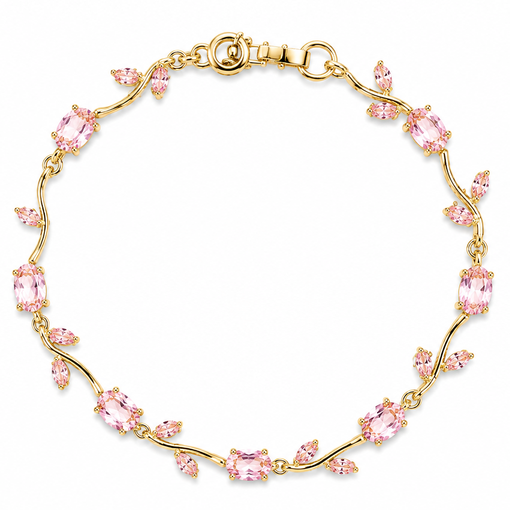 Gold bracelet with pink gemstones on a white background