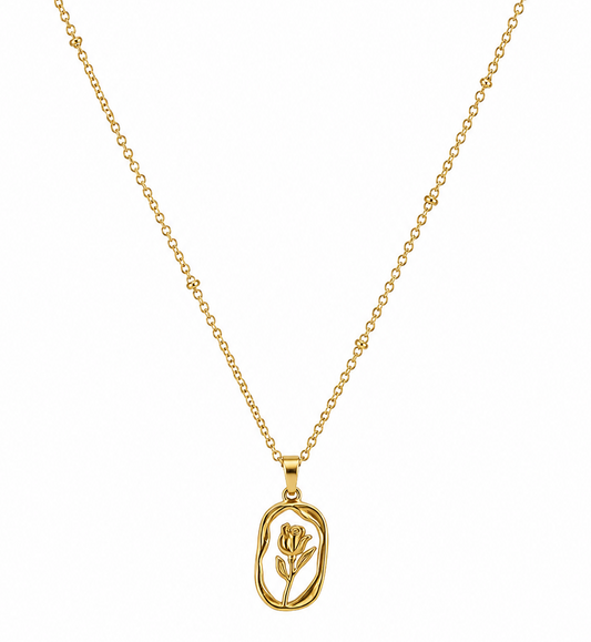 A delicate gold chain necklace featuring a small, openwork oval pendant with a stylized flower design, displayed against a solid white background.