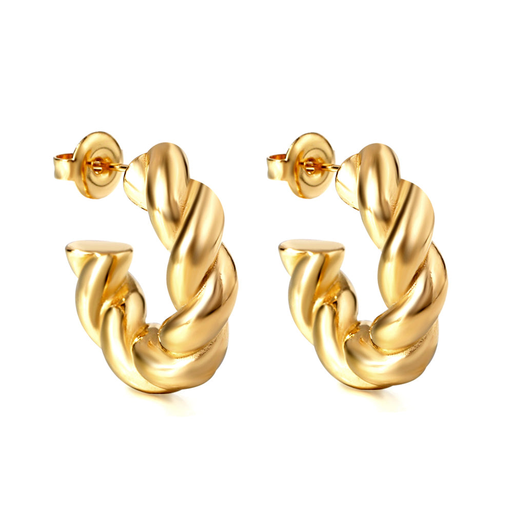 Gold hoop earrings on a white background