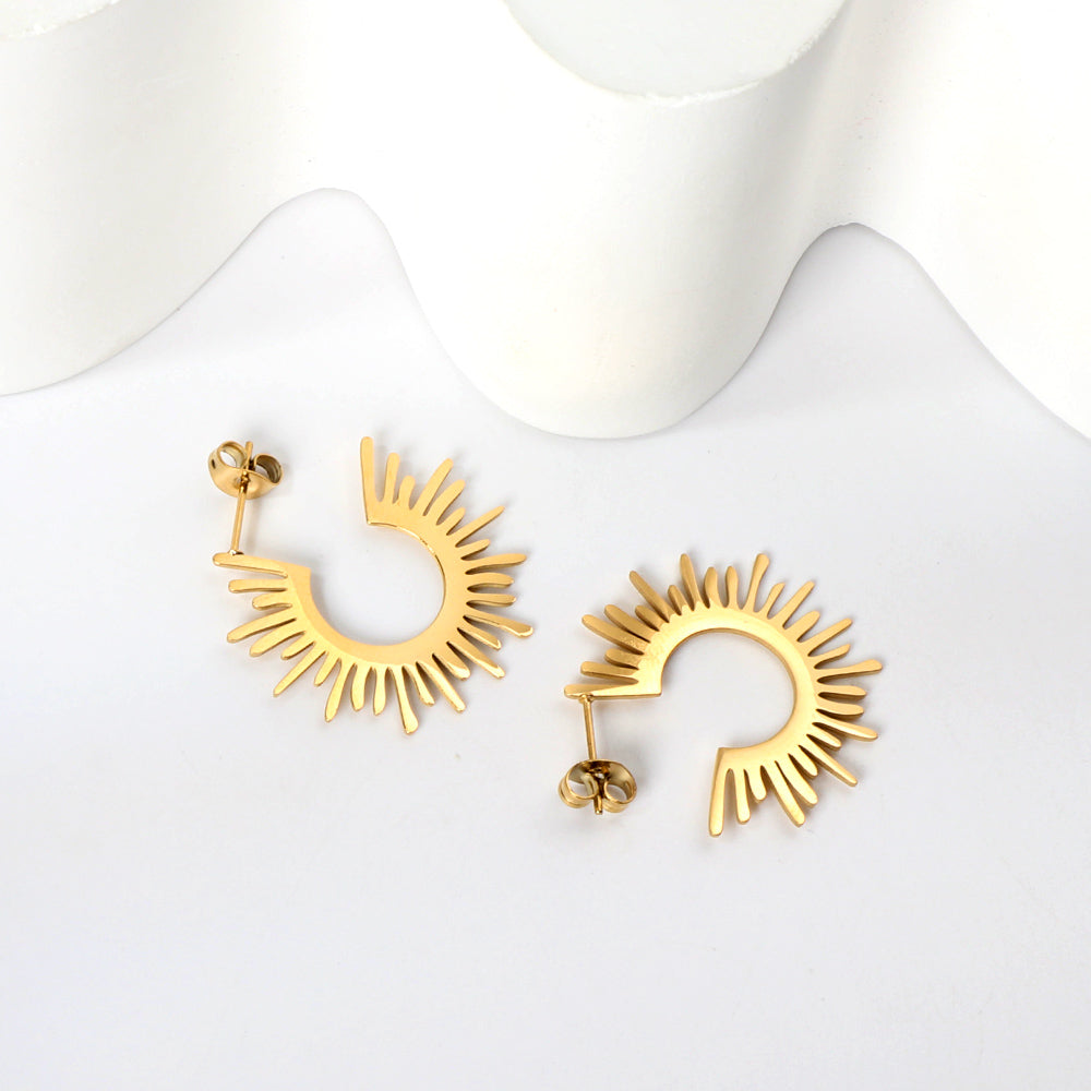 Gold hoop earrings on a white background