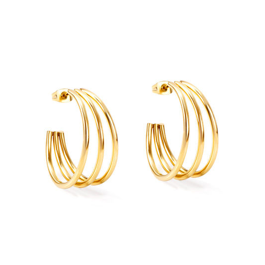 Gold hoop earrings on a white background